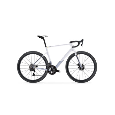 Side-on profile of the Basso Diamante SV in White at bicycle. Richmond, London, illustrating the refined aerodynamic silhouette, Shimano Dura-Ace drivetrain, and specialist Italian carbon fibre construction for elite professional road racing.